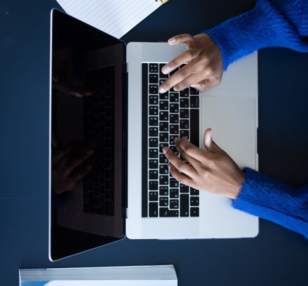 Person typing on a laptop