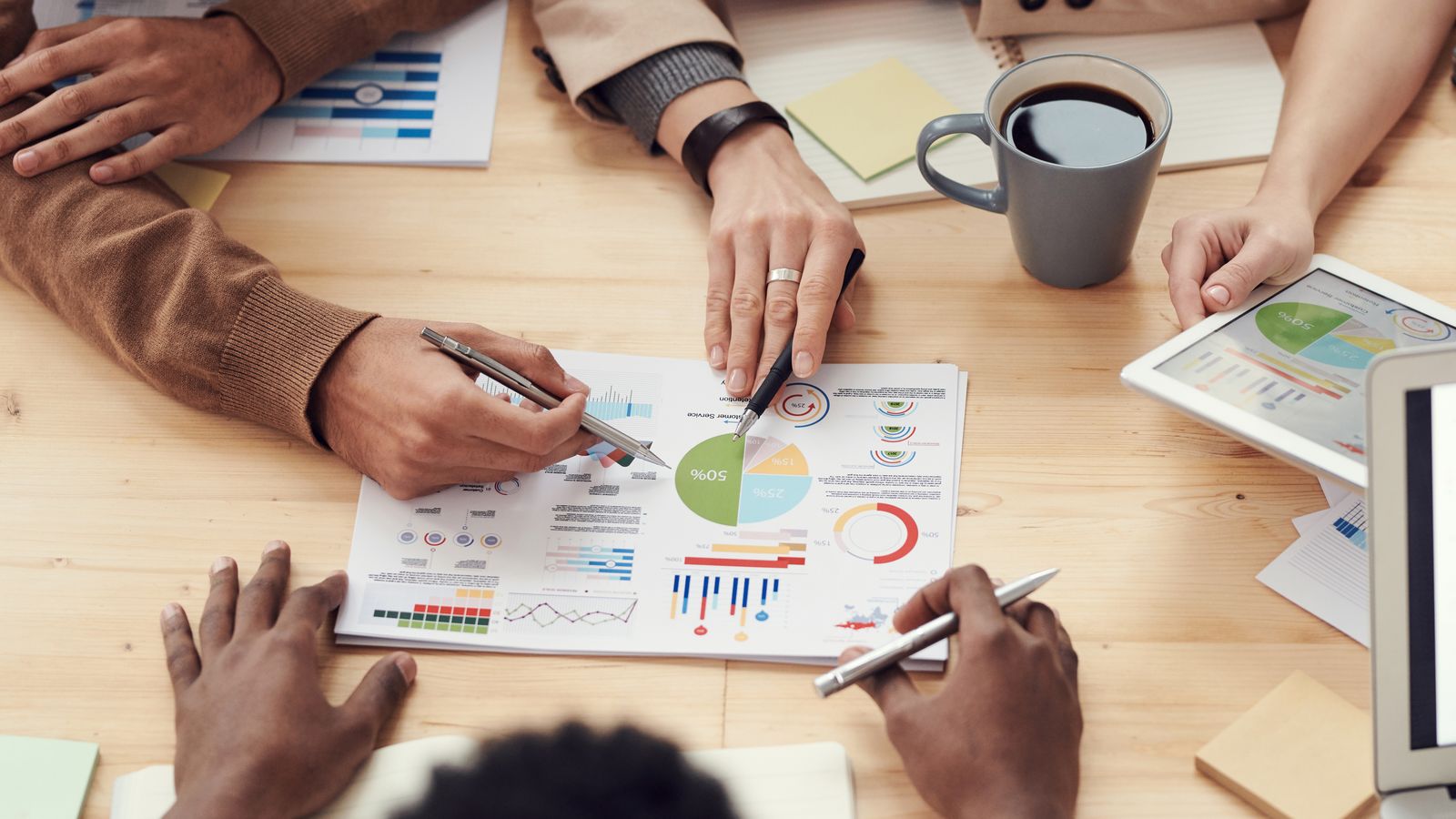 Sales team reviewing performance charts in a meeting