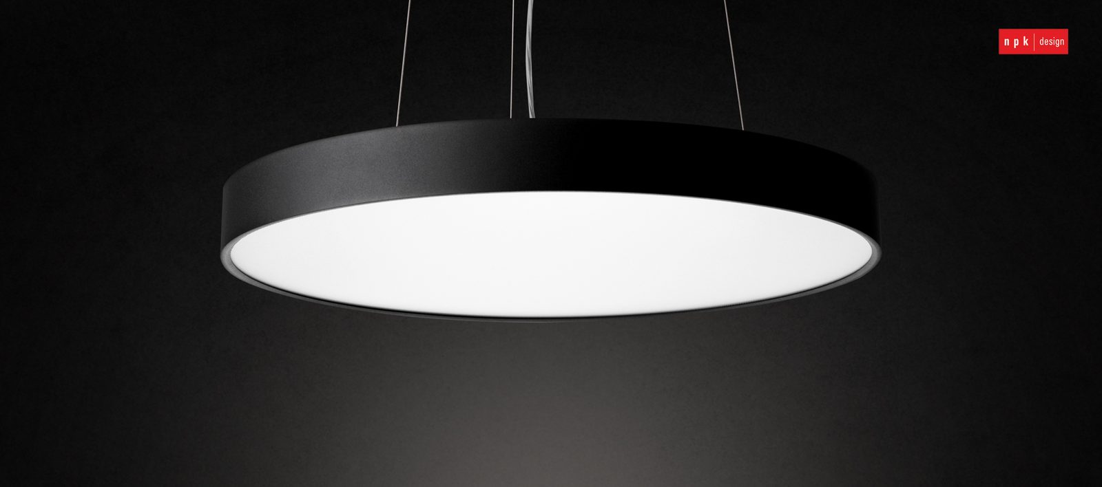 A black Purati circular pendant light