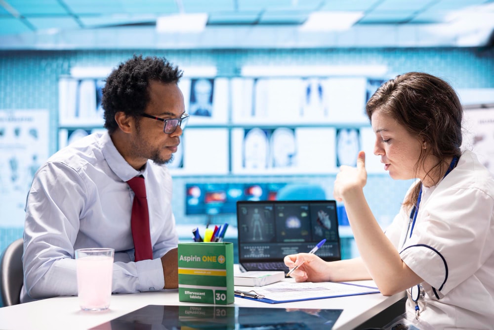 Medical Sales Rep discussing pharmaceuticals with doctor