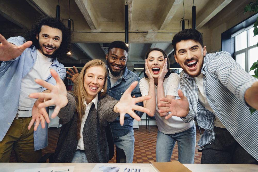 Happy overjoyed business team celebrate corporate sales victory
