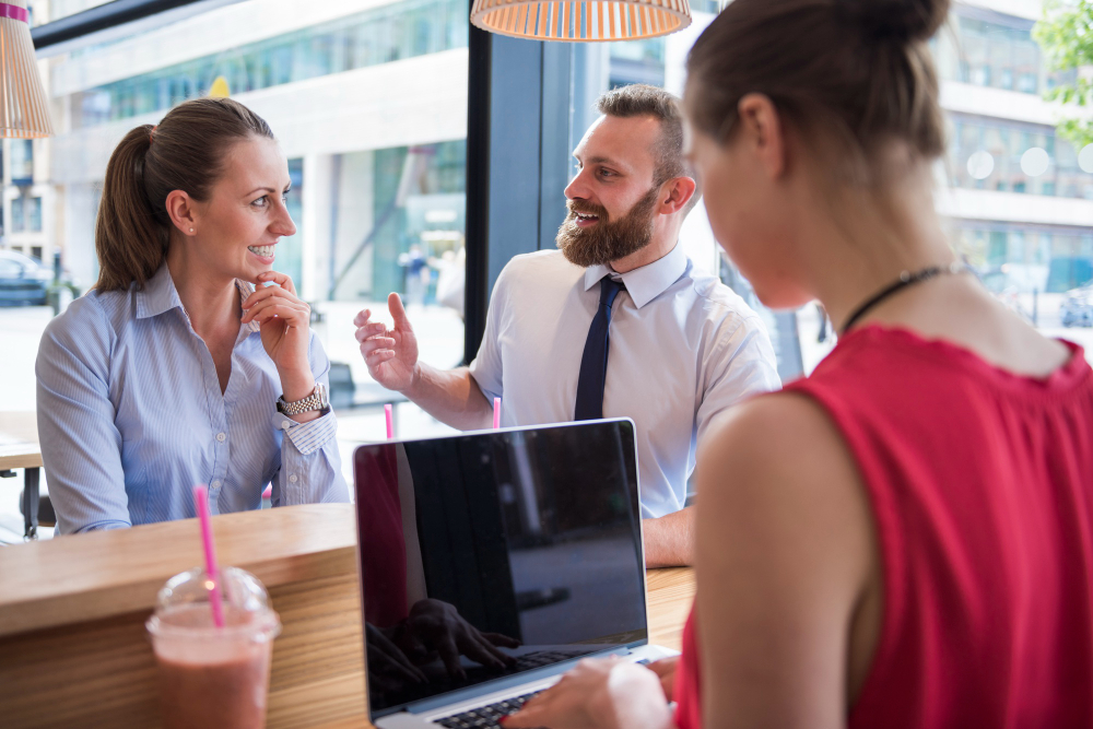 Salespeople meeting in a cafe