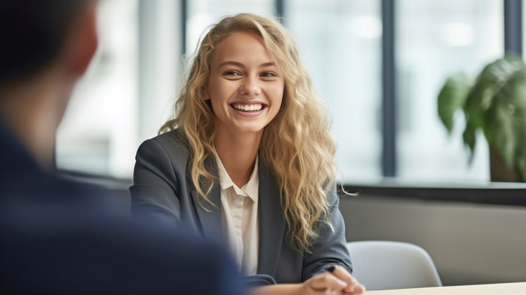 Young female sales person smiling during an interview for a new sales job